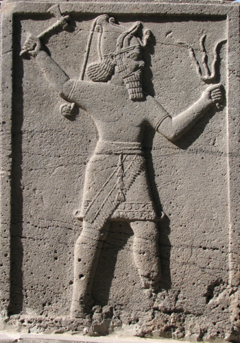 Teshub holding axe & trident-thunderbolts neo-Khattusha stele